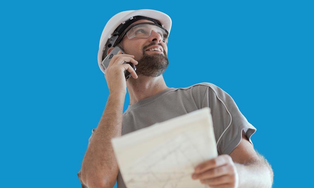 Construction worker speaking on phone